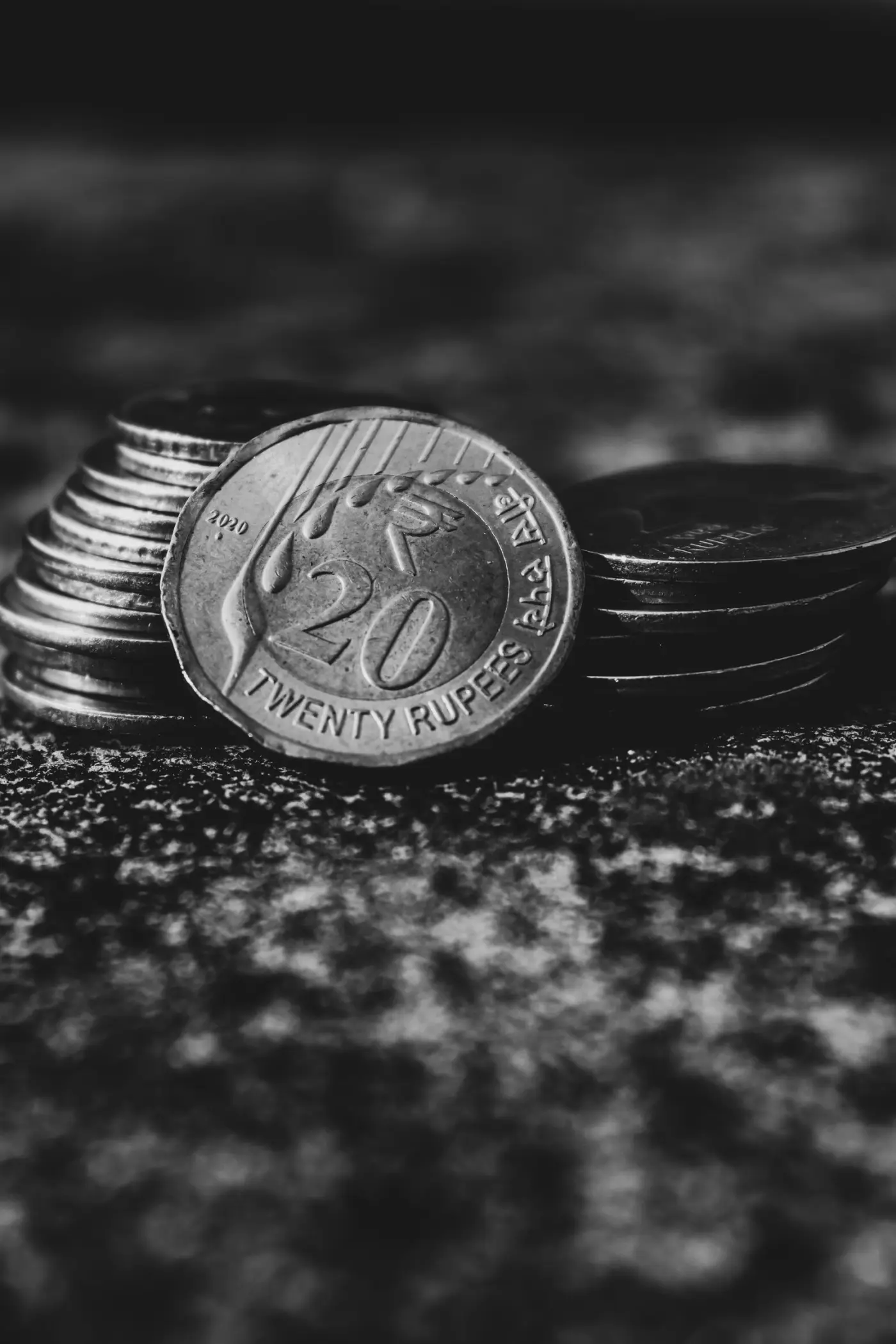 A stack of coins in low light