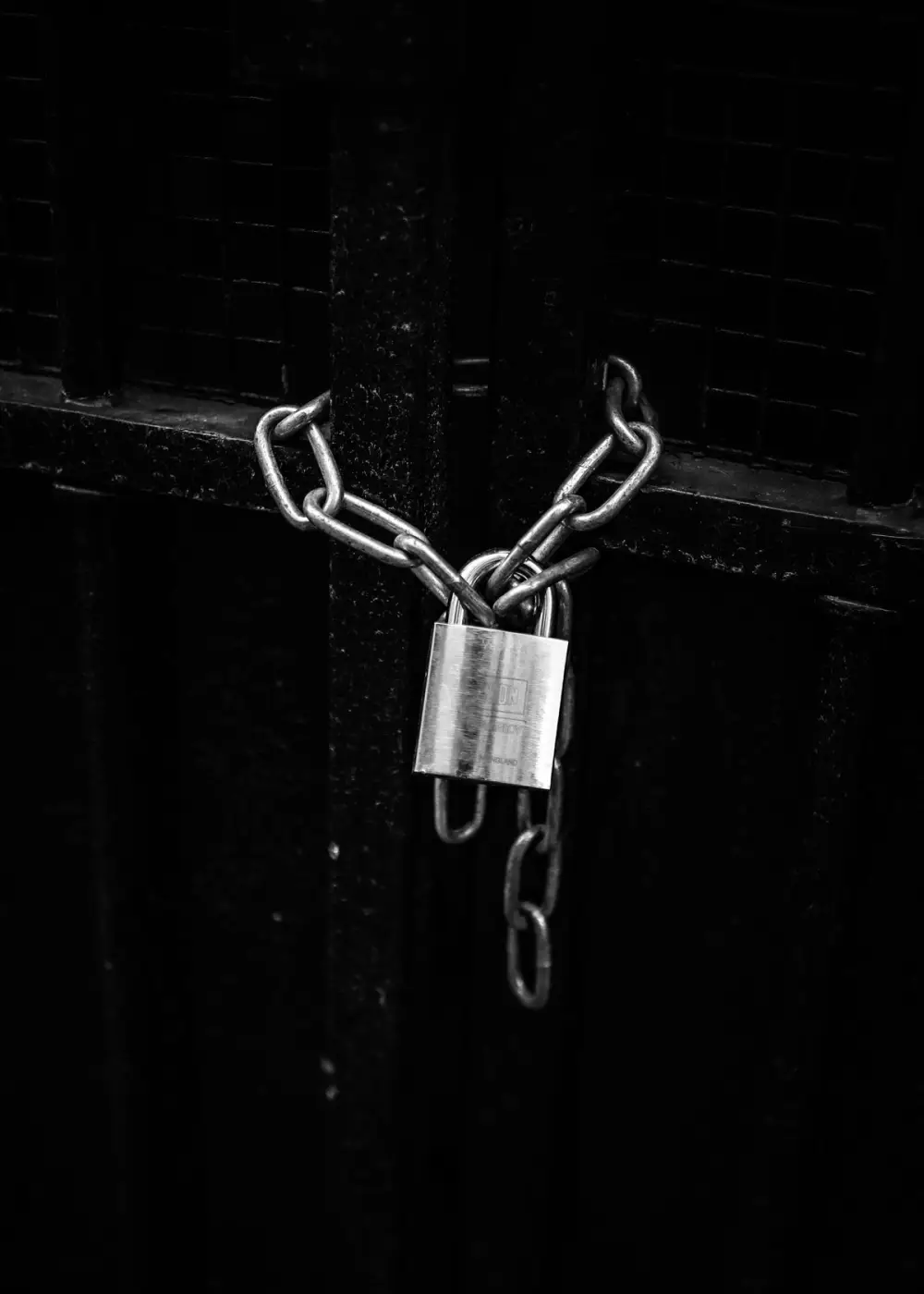A padlock holding a chain closed